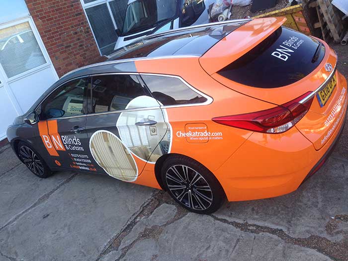 hyundai estate car with 3/4 vinyl wrap including a full colour change orange rear