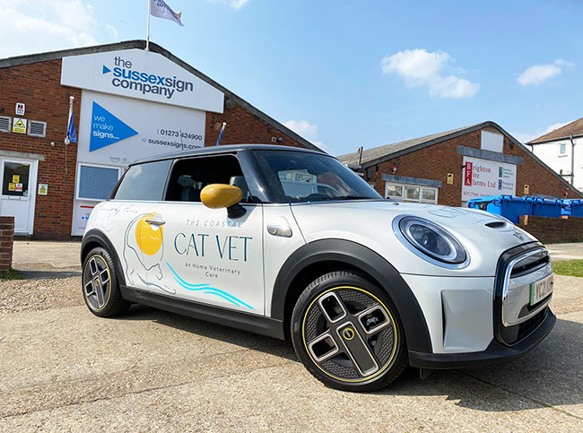 white electric mini signwritten to all panels for Coastal Cat Vets of Brighton & Hove