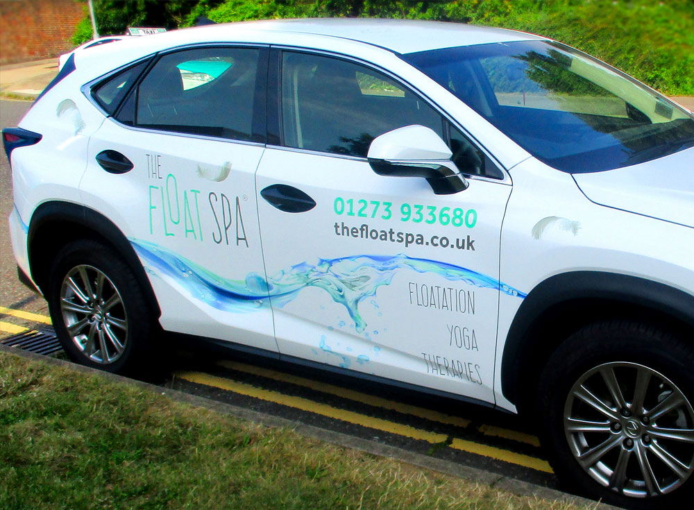 5 door medium sized family hatchback with vinyl signwriting promoting The Float Spa in Hove