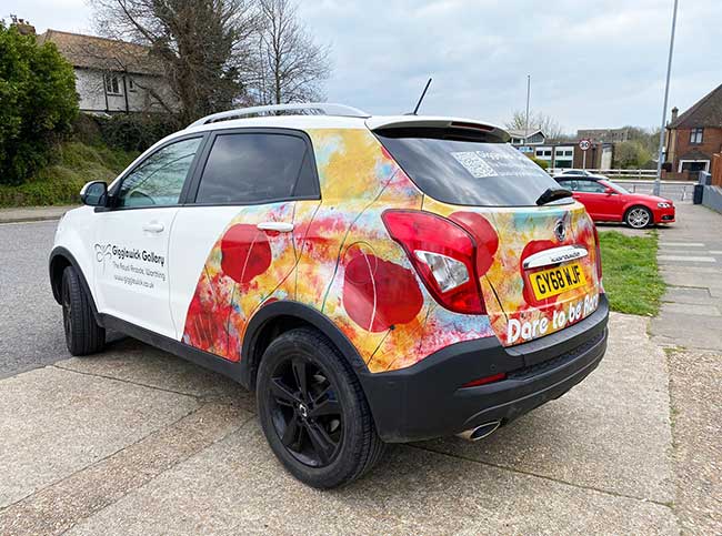 5 door medium sized family hatchback with 100% digitally printed vinyl coverage to rear panels promoting a Sussex gallery