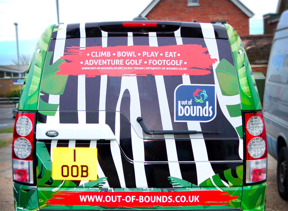 Landrover Discovery with 100% full vinyl wrap to rear panels advertising Out Of Bounds