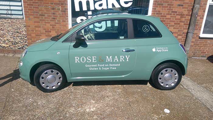 small fiat 3 door hatch with minimal digitally printed vinyl decals promoting Rose & Mary food on demand