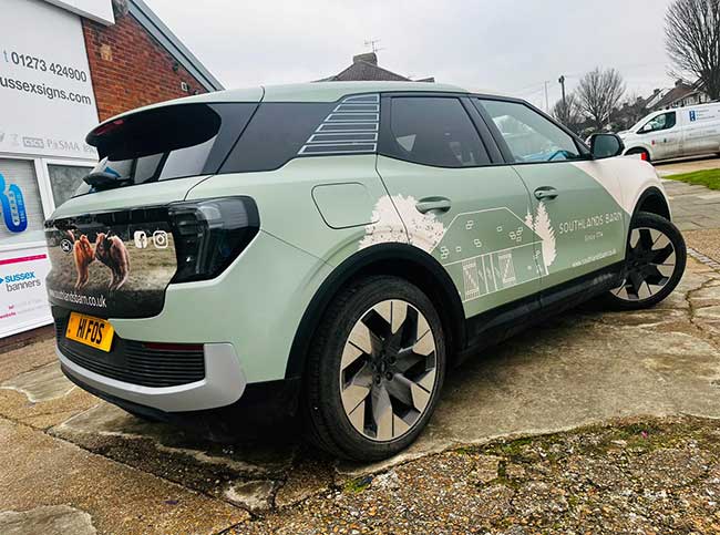 5 door medium sized family hatchback with vinyl signwriting promoting Southlands Barn wedding venue Pulborough