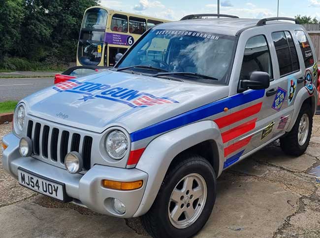 American Jeep with fun vinyl signwriting with Top Gun design