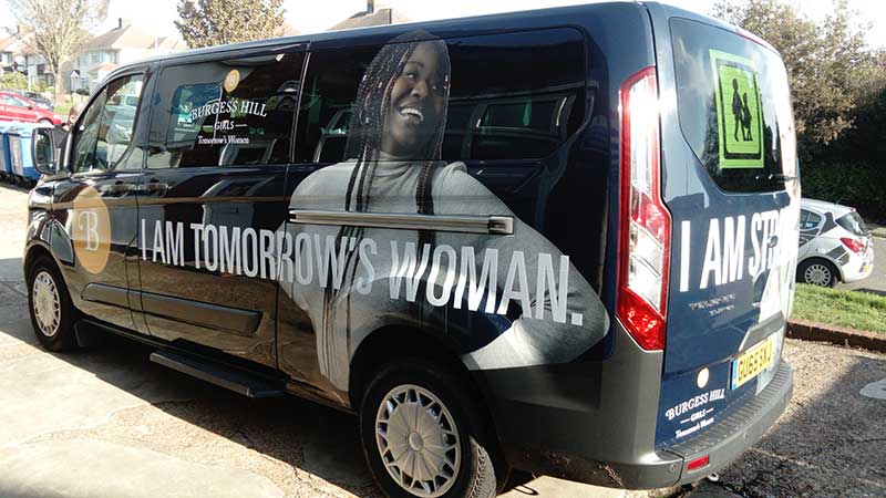 Blue minibus with digitally printed large vinyl graphics plus white vinyl lettering for Burgess Hill School for Girls