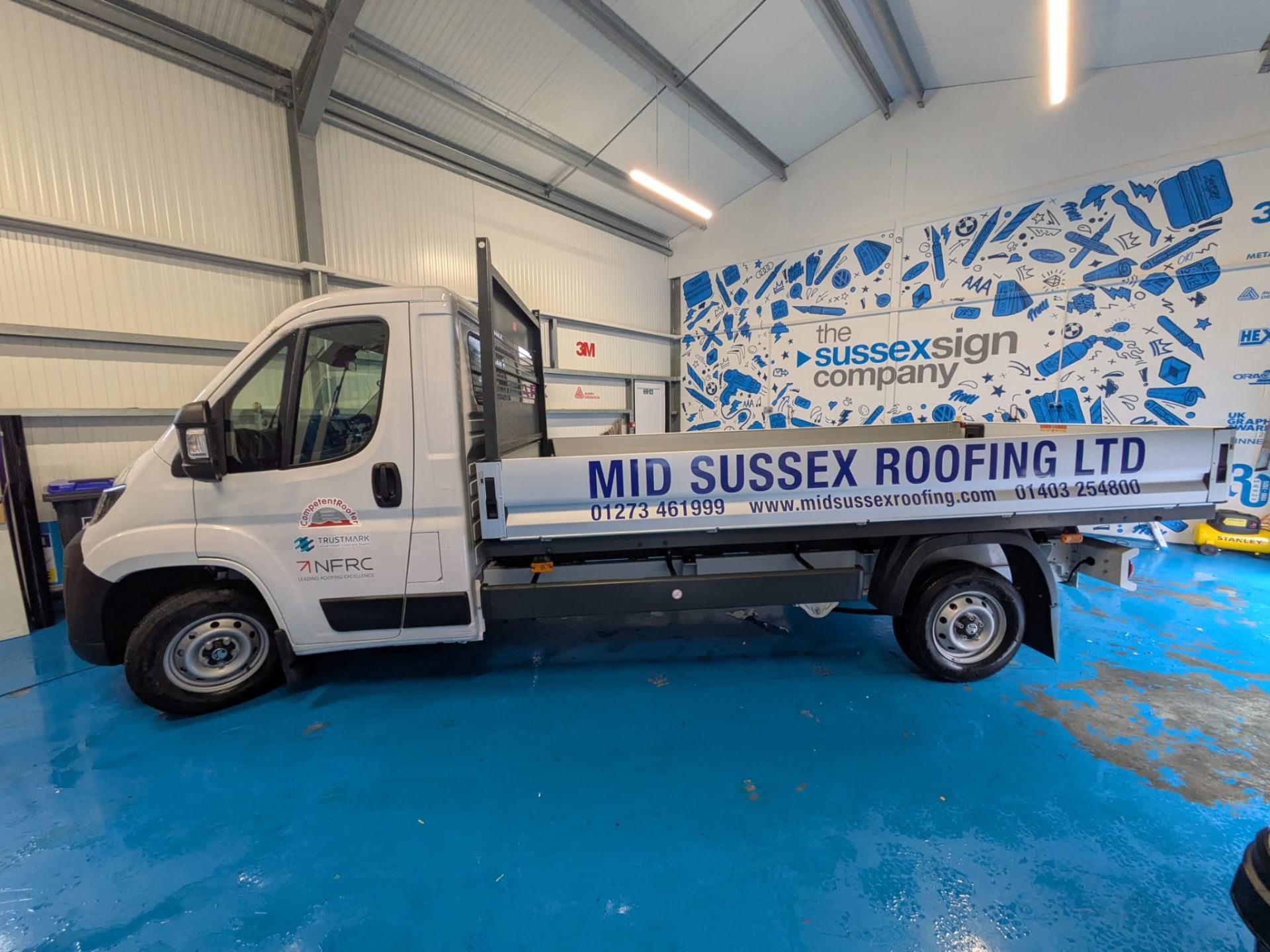 simple one colour cut vinyl graphics advertising Mid Sussex roofing commercial vehicles