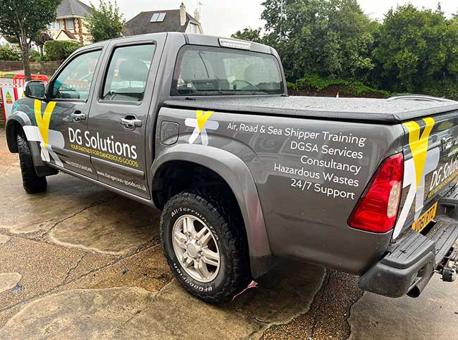 Vinyl lettering & logo applied to a twin cab truck