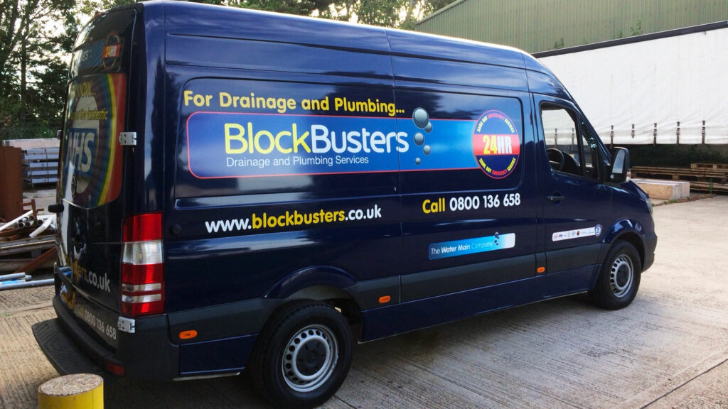 Large van with Blockbuster drainage vinyl decal branding