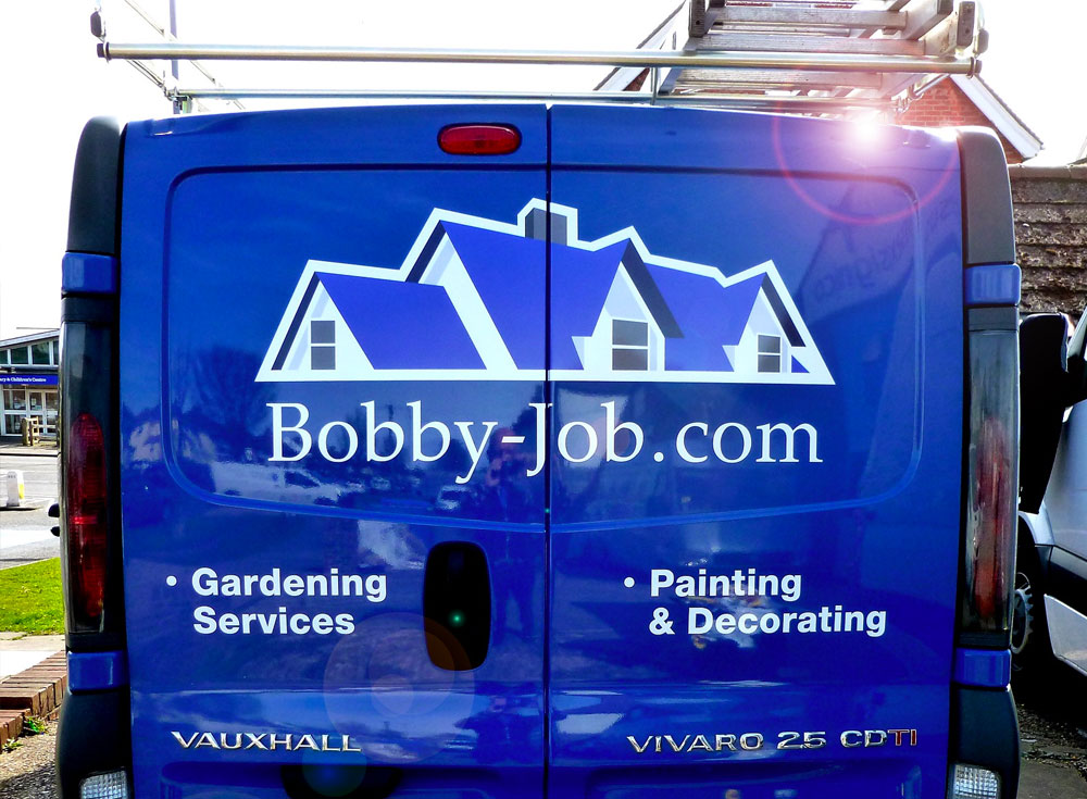 Vauxhall Vivaro van with white vinyl & printed decals advertising Bobby-Job services