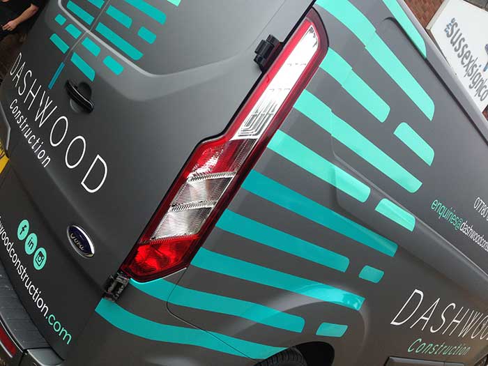 Two different colours of cut vinyl used to promote Dashwood construction services on a Ford Transit van zoomed image