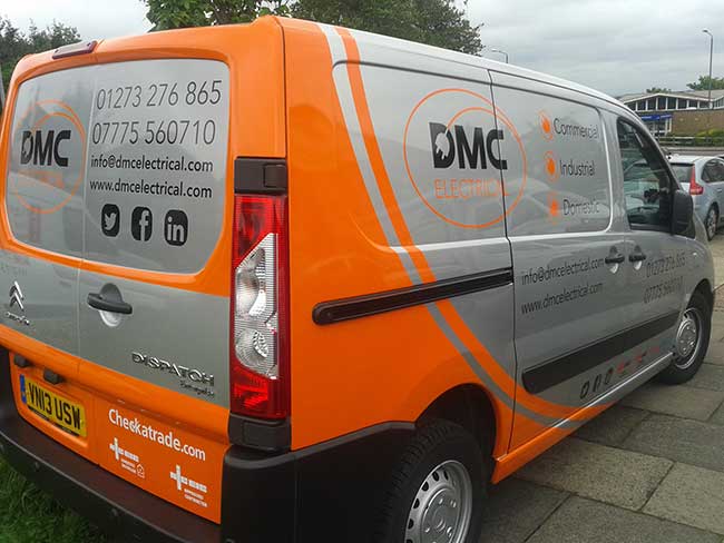 Black, White and Orange cut vinyl used to advertise DMC Electrical silver Citroen van with clever full coverage to rear panel