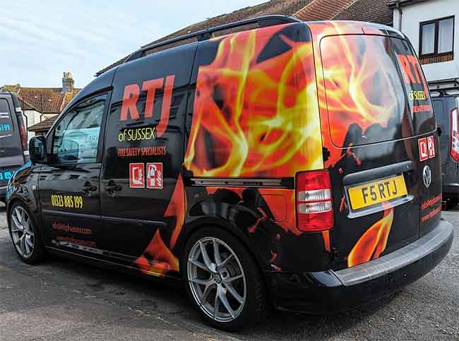 Digital printed vinyl and cut vinyl letters including a rear panel van wrap promoting RTJ Fire safety