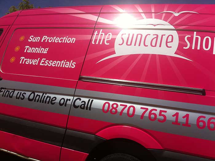 The Sun Care shop delivery van with digitally printed rear panels and vinyl letters applied to side, side view