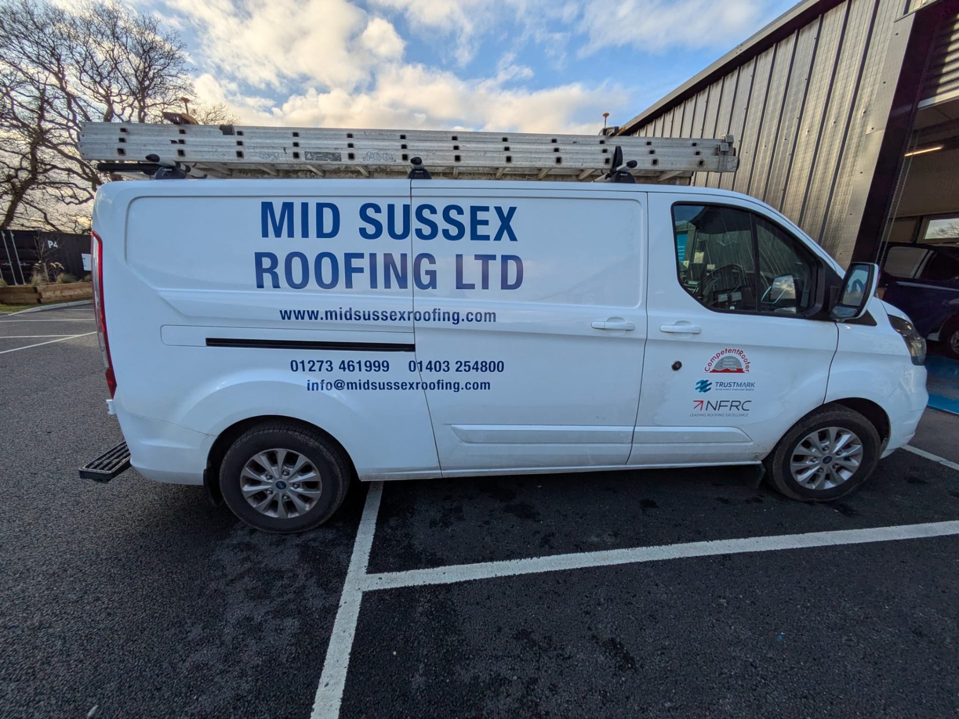 simple one colour cut vinyl signwriting graphics for Mid Sussex Roofing