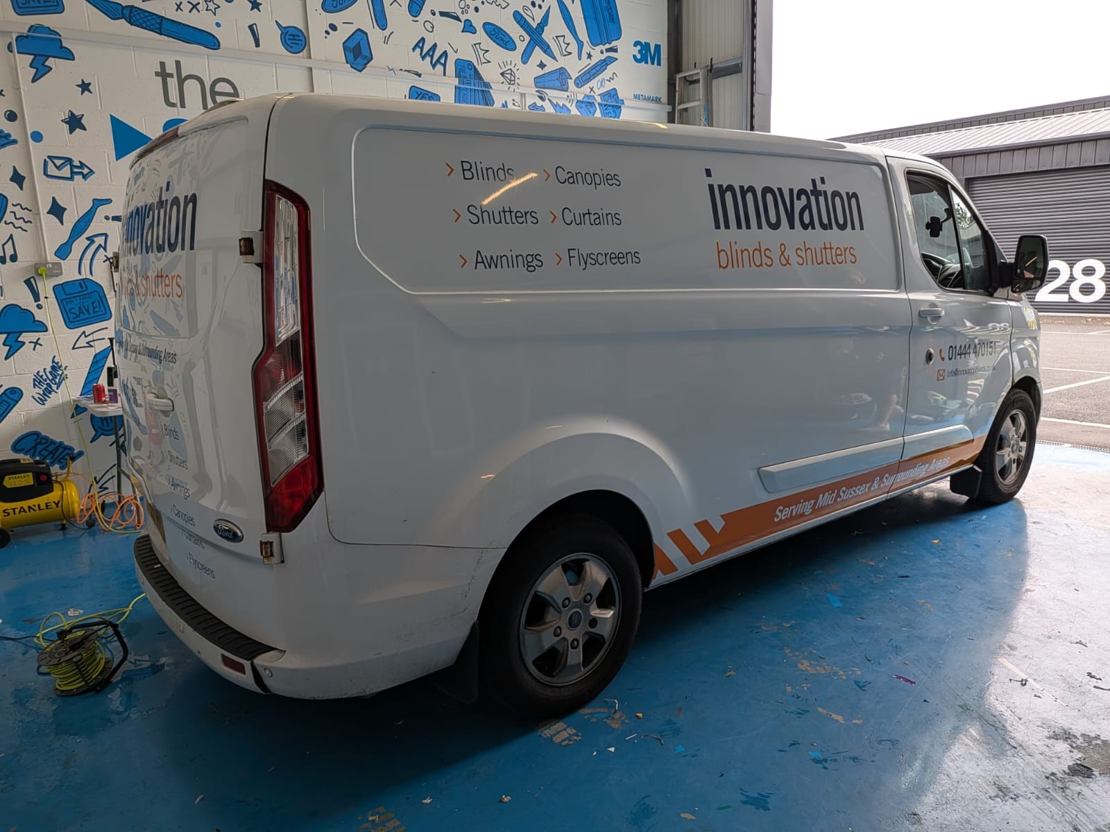 Flat Cut Vinyl Signwriting to white Ford Transit showcasing the services of Innovation Blinds from Haywards Heath in East Sussex